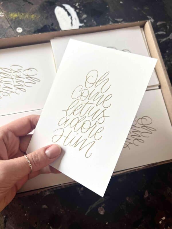 Festliche christliche Grußkarte mit Goldschrift und religiösem Text.