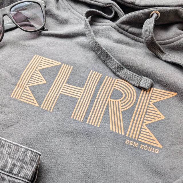 Kleidungsstück Mit &Quot;Danke Dem König&Quot; Aufdruck, Christliche Merchandising-Produkte.