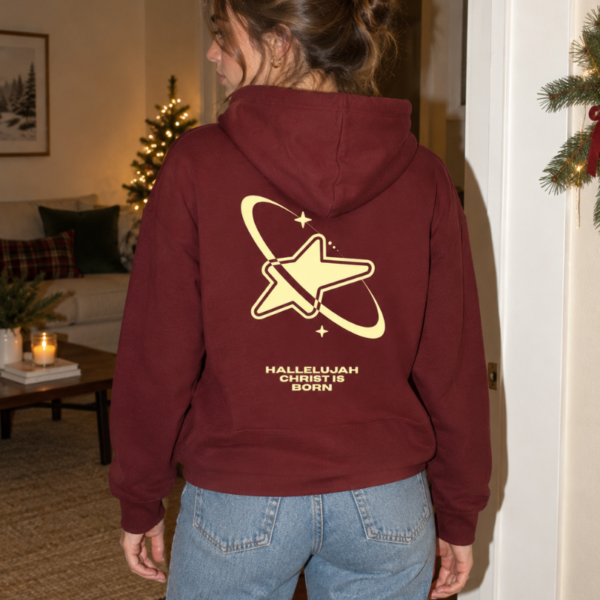 Hoodie mit Aufdruck: HALLELUJAH CHRIST IS BORN, Stern und Orbit-Logo auf der Rückseite.